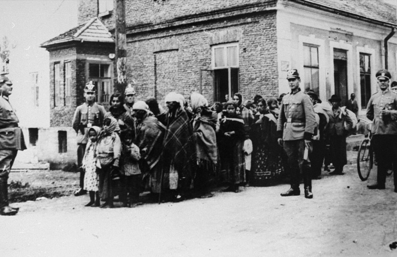 German police guard a group of Roma (Gypsies) who have been rounded up for deportation to Poland.