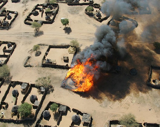 Beginning of the burning of the village of Um Zeifa in Darfur after the Janjaweed looted and attacked.