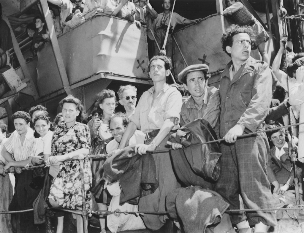 Refugees crowd the rail of the Aliyah Bet ("illegal" immigration) ship "Josiah Wedgwood," anchored at the Haifa port. [LCID: 76559]