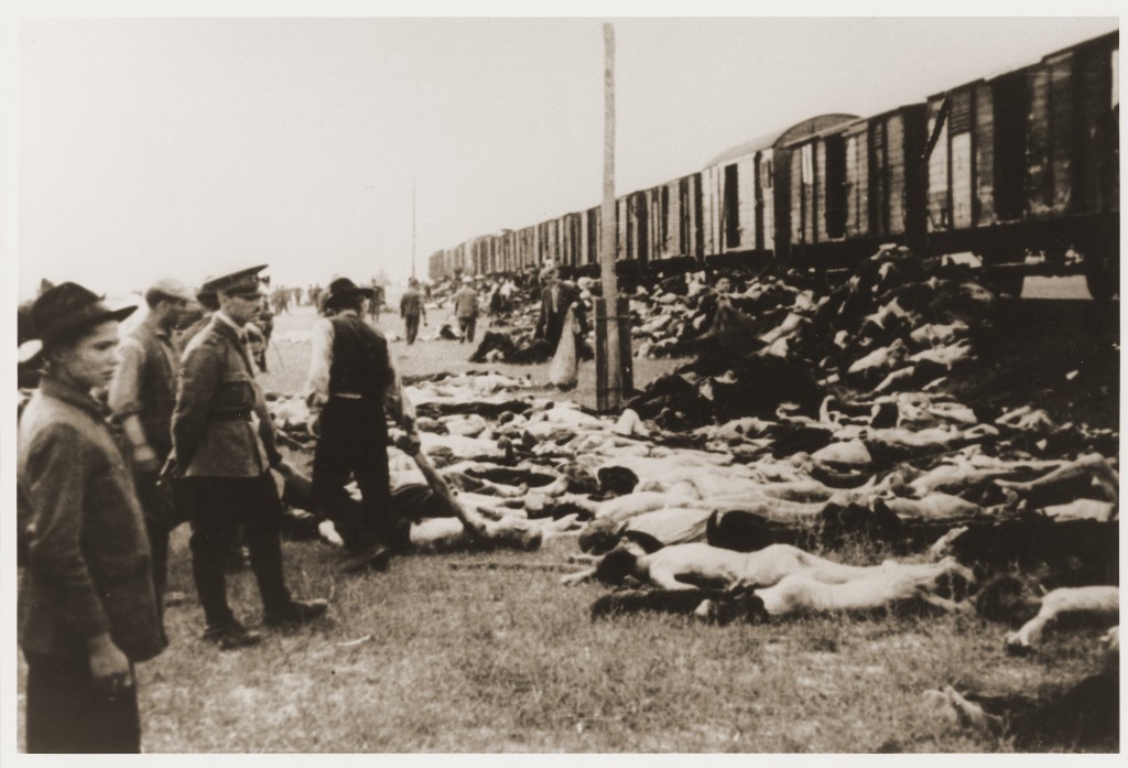 During the deportation of survivors of a pogrom in Iasi to Calarasi or Podul Iloaei, Romanians halt a train to throw off the bodies ...