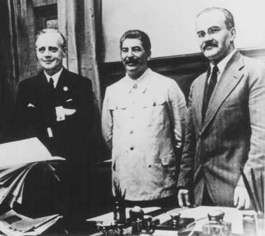 Nazi foreign minister Joachim von Ribbentrop (left), Soviet leader Joseph Stalin (center), and Soviet foreign minister Viacheslav ...