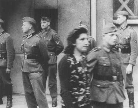 Simone Schloss, a Jewish member of the French resistance, under guard after a German military tribunal in Paris sentenced her to ...