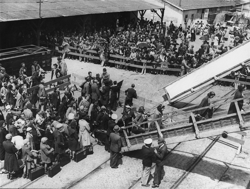 Jewish refugees in Lisbon, including a group of children from internment camps in France, board a ship that will transport them to ...