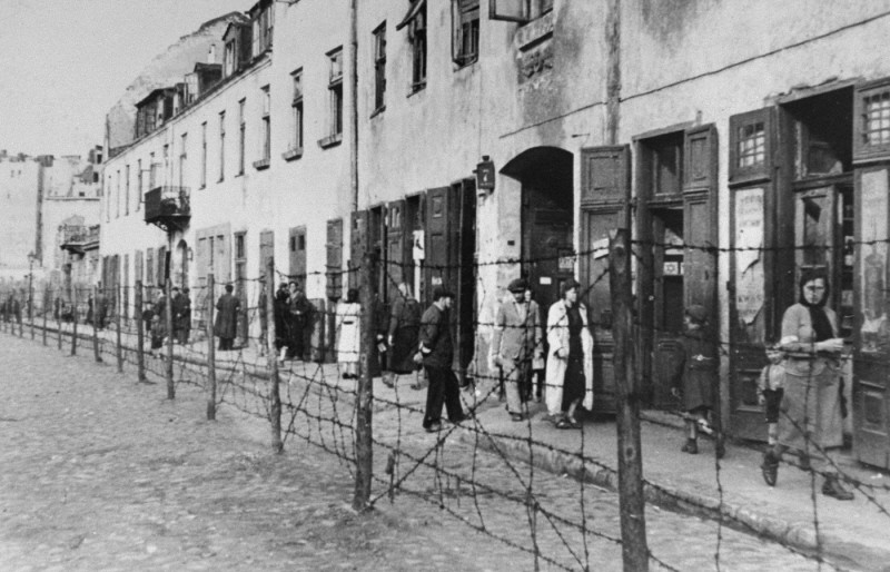 View of a barbed-wire fence separating part of the ghetto in Krakow from the rest of the city.