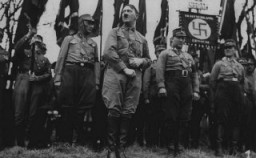 Adolf Hitler stands with an SA unit during a Nazi parade in Weimar [LCID: 02286]