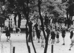 A scene staged by the Nazis for an International Red Cross inspection of the Theresienstadt ghetto. [LCID: 73359a]