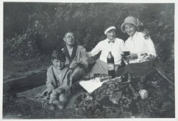 Fritz Glueckstein (left) on a picnic with his family in Berlin, Germany, 1932. Fritz's father was Jewish—he attended services in a liberal synagogue—and his mother was Christian. Under the Nuremberg Laws of 1935, Fritz would be classified as mixed-raced (Mischling), but since his father was a member of the Jewish religious community, Fritz was classified as a Jew.