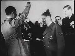 In Berlin, Germany, officials from Nazi Germany, Fascist Italy, and Imperial Japan sign the ten-year Tripartite Pact (the Three-Power Agreement), a military alliance. The pact sealed cooperation among the three nations (Axis powers) in waging World War II. This footage comes from "The Nazi Plan," a film produced and used by the United States in the prosecution at the Nuremberg trials.