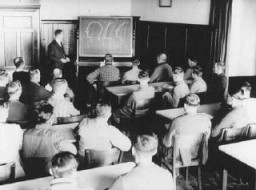 Germans attend a class in racial theory. Germany, date uncertain. [LCID: 70366]