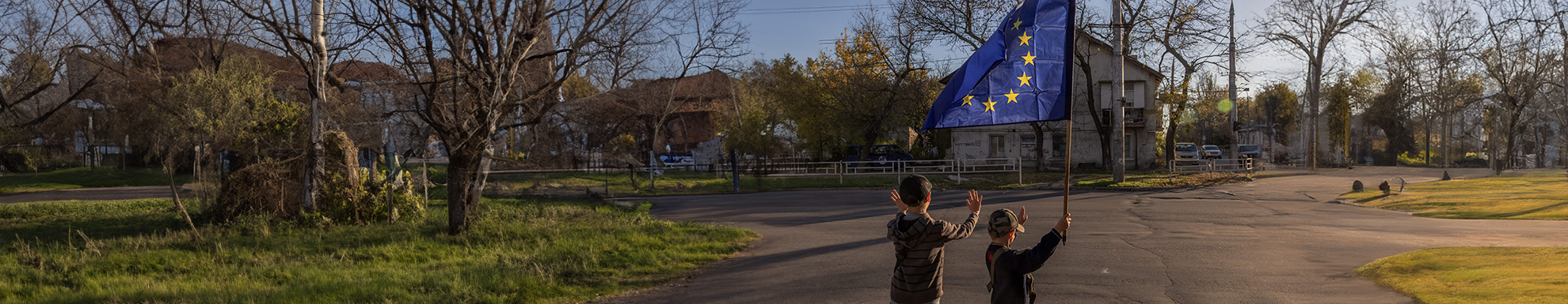 Two young Ukrainian boys holding and EU flag