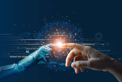 AI, Machine learning, Hands of robot and human touching on big data network connection background, Science and artificial intelligence technology, innovation and futuristic.