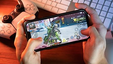 Gamer playing Apex Legends Mobile game on iPhone 13.