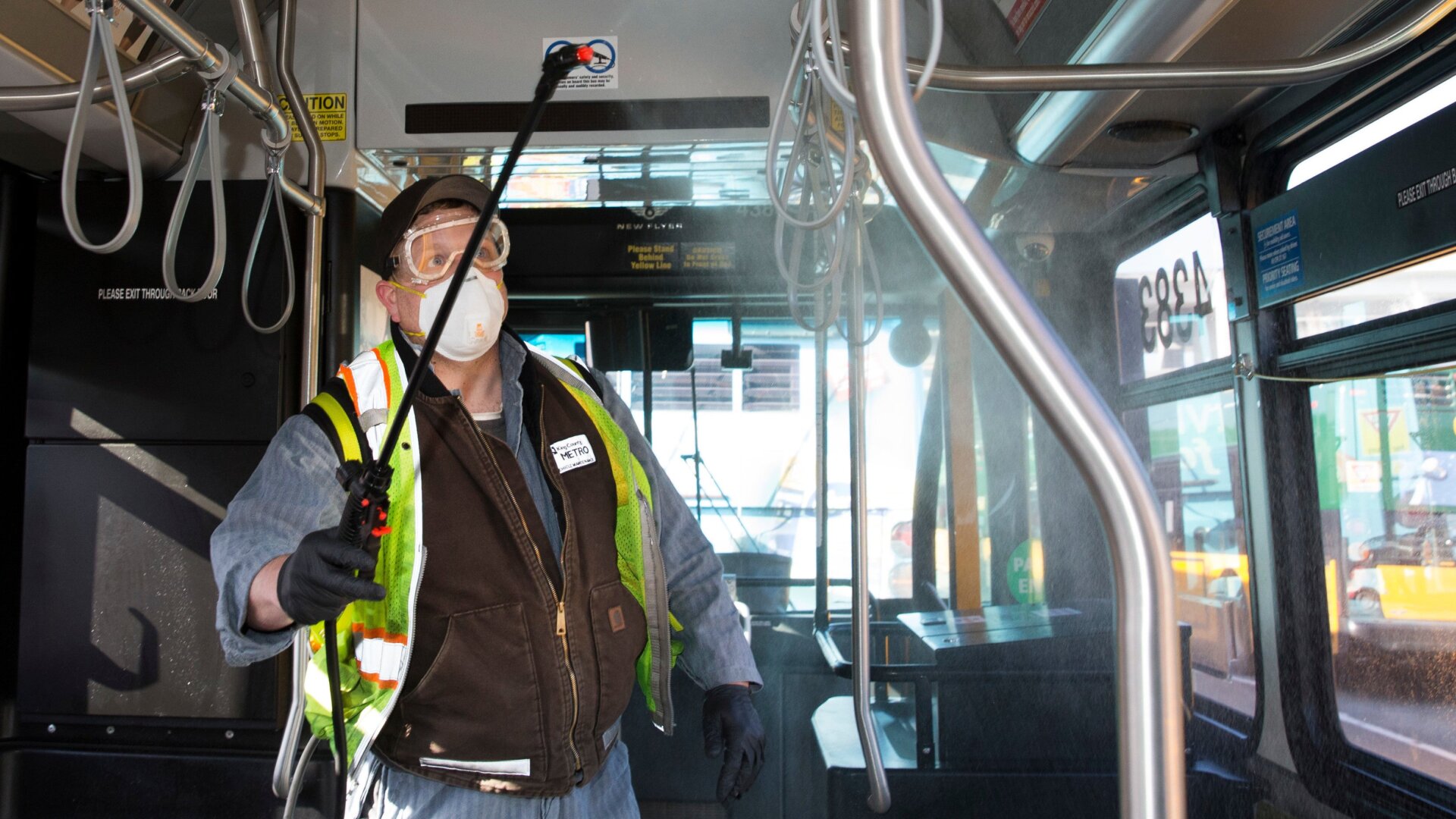 An equipment service worker for King County Metro, sprays Virex II 256, a disinfectant, throughout a metro bus on March 4, 2020 in Seattle, Washington.