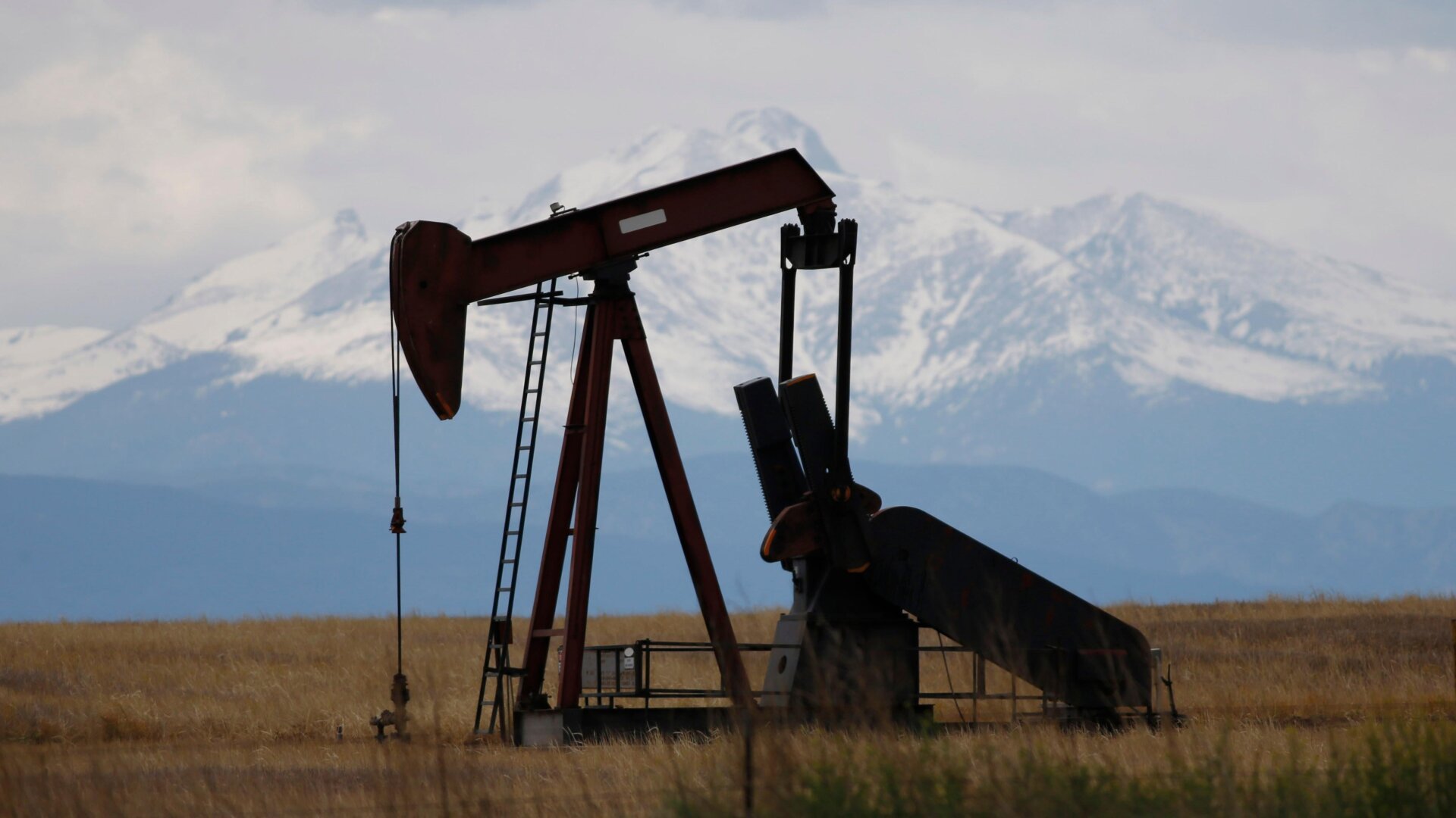 Here, oil pumpjacks work in a field near Firestone, Colorado. Biden’s new oil and gas auction will transform about 140,000 acres of public land.