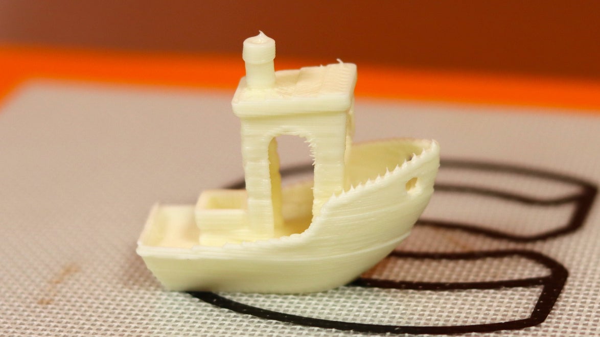 The iconic 3DBenchy model made out of white chocolate.