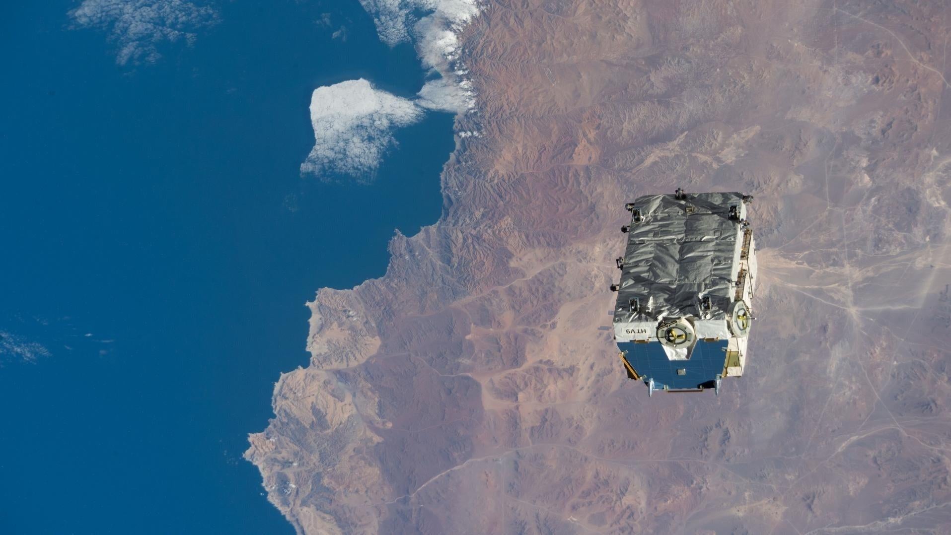 The cargo pallet after being tossed by the by the Canadarm2 robotic arm in 2021.