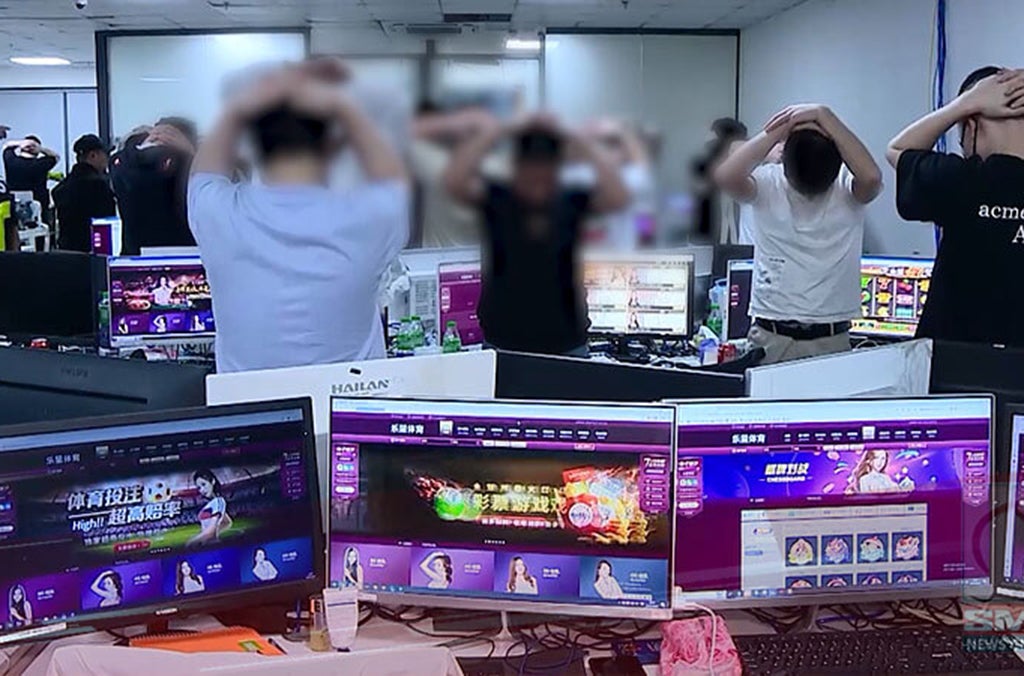 An undated photo released by Interpol shows the arrest of alleged scammers in the Philippines.