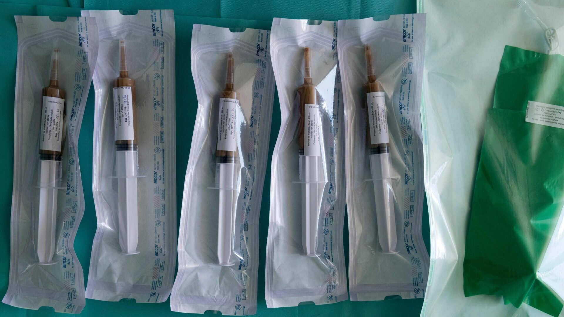 Syringes mixed with stool being used for a fecal microbiota transplant.