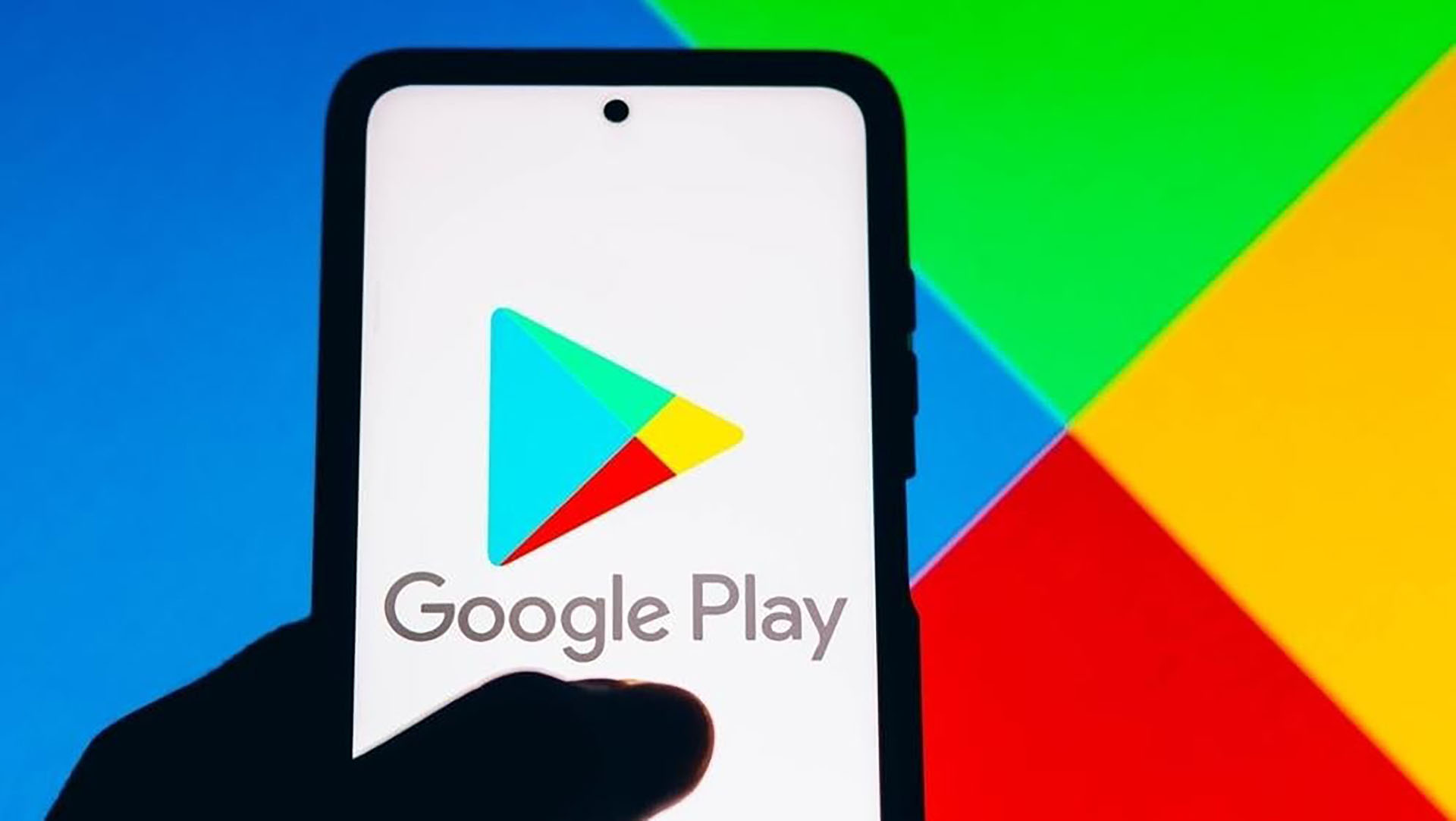 Image of smartphone with Google Play on the screen holding