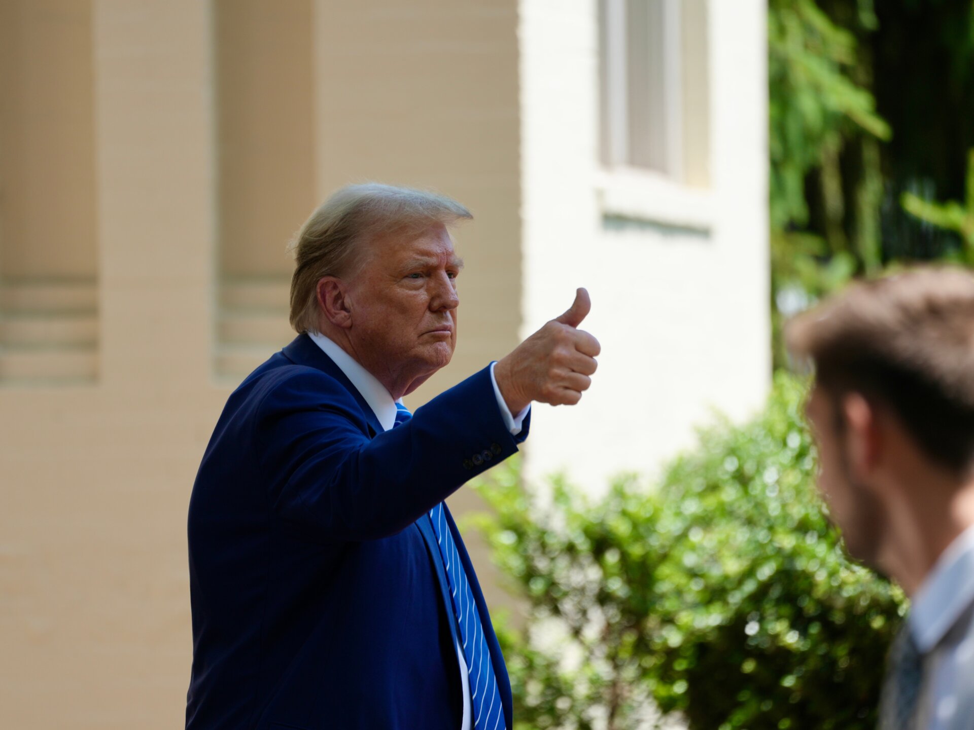 Donald Trump giving a thumbs up