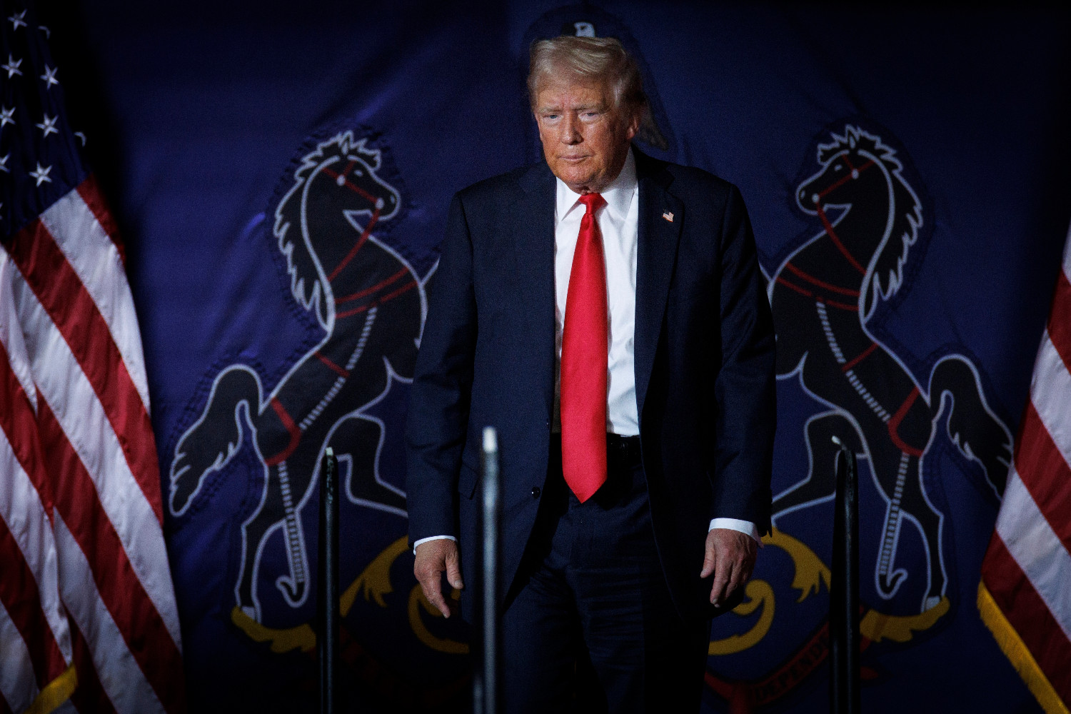 Convicted felon Donald Trump walks on stage during a campaign event at the New Holland Arena in Harrisburg, Pennsylvania, on July 31, 2024