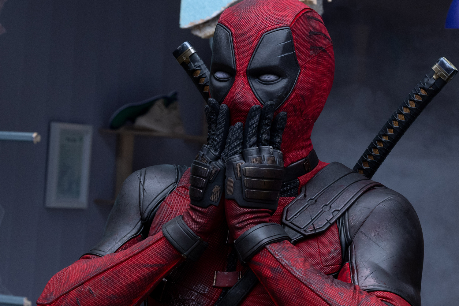 Deadpool frets, opposite a grimacing Wolverine