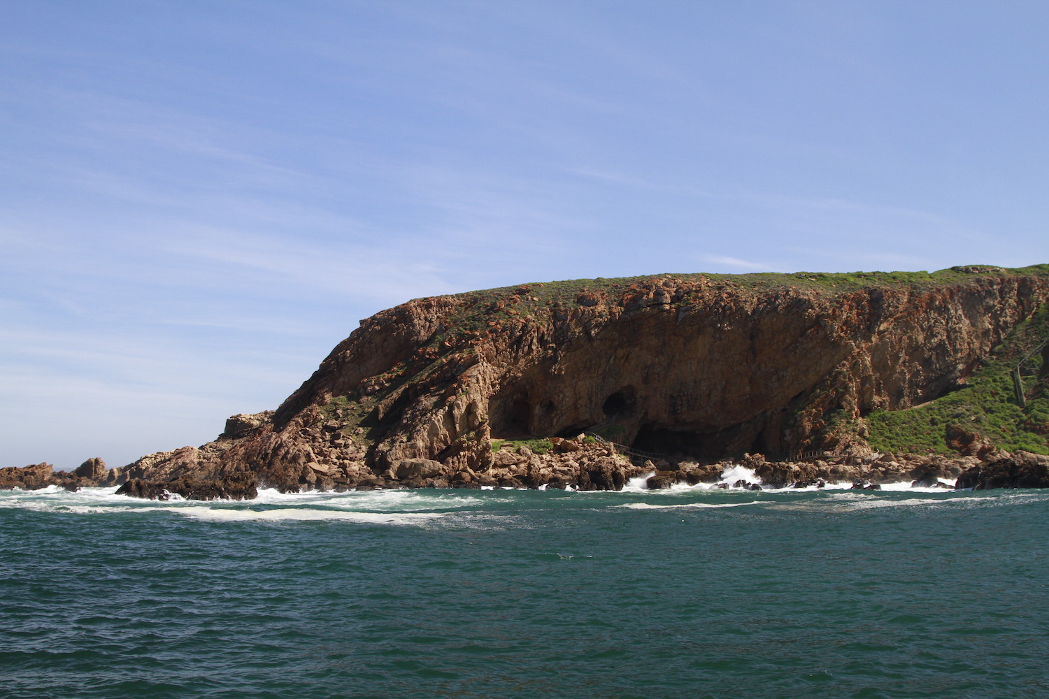 View of the shoreline at Pinnacle Point from boat