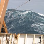 Image of a large wave off bow of a ship