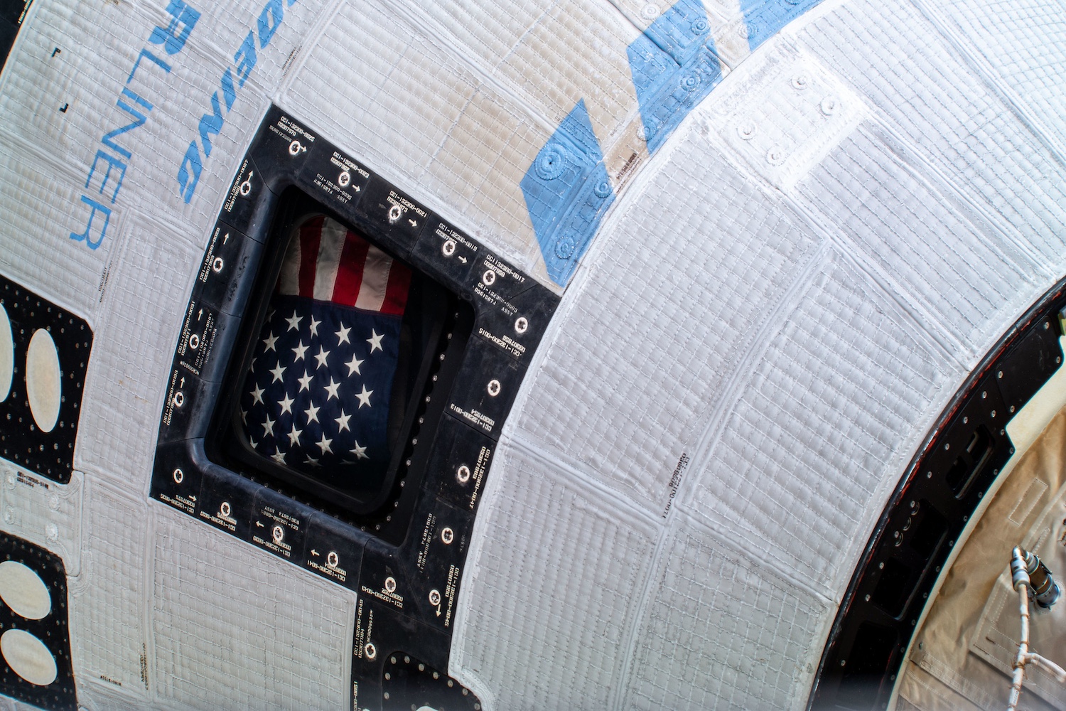 The American flag pictured inside the Starliner spacecraft