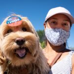 Tara Robinson voted but her dog Leo got to wear the sticker in the California recall election at a polling center set up at El Camino Real high school in Woodland Hills, CA Tuesday, September 14, 2021.