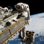 NASA astronaut and Expedition 68 Flight Engineer Woody Hoburg rides the Canadarm2 robotic arm while maneuvering a roll-out solar array toward the International Space Station’s truss structure 257 miles above the Pacific Ocean