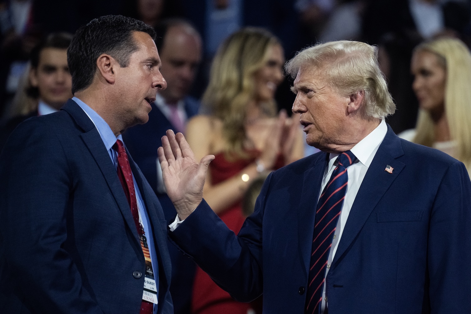 Donald Trump, the Republican presidential nominee, talks with former Rep. Devin Nunes, R-Calif., Trump Media CEO, in the Fiserv Forum on the third day of Republican National Convention in Milwaukee, Wis., on Wednesday, July 17, 2024.