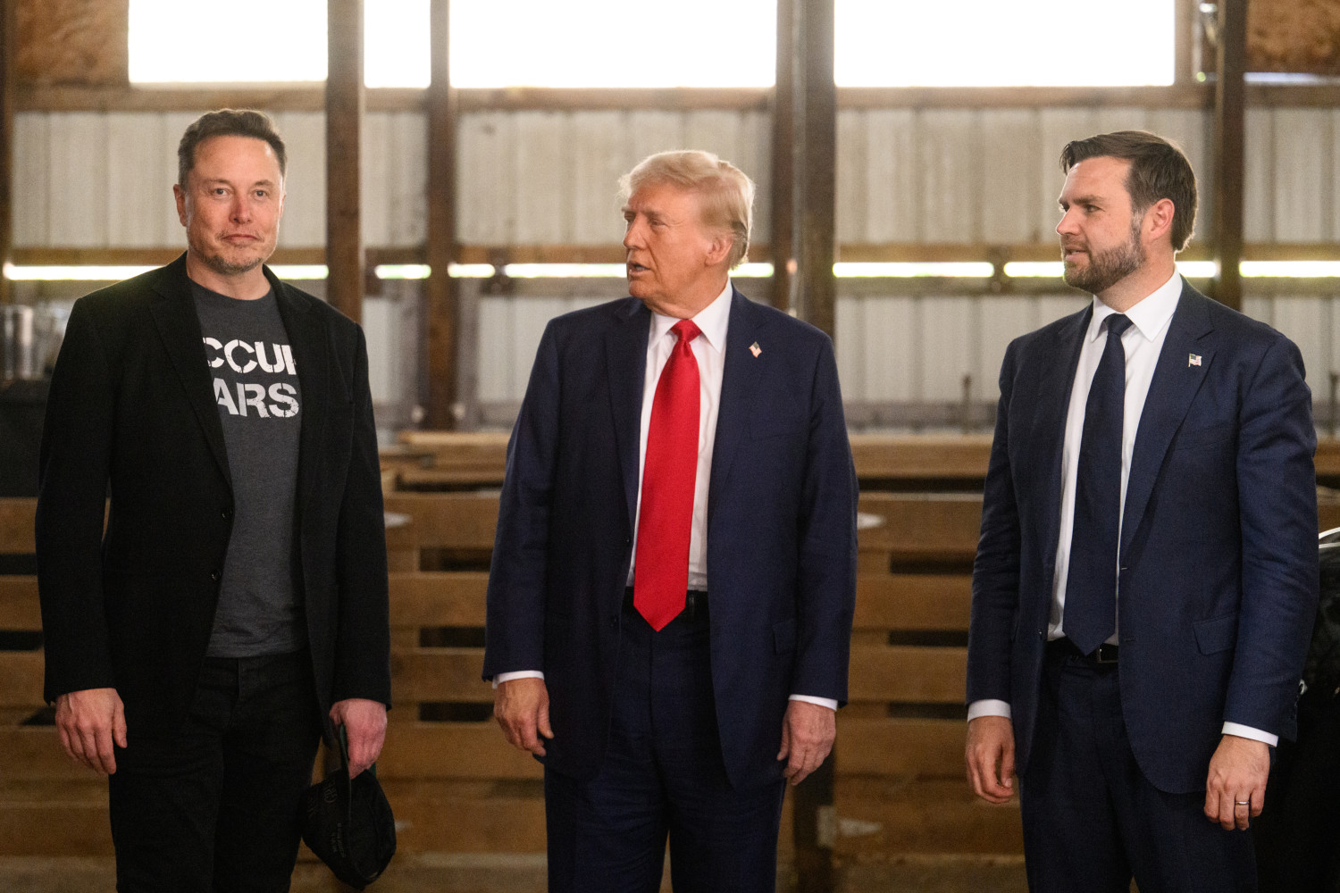 Elon Musk (left) Donald Trump (center) and JD Vance in Butler, Pennsylvania, on Saturday, Oct. 5, 2024.