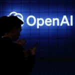 The OpenAI logo with a silhouetted figure in the foreground.