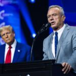 Robert F. Kennedy Jr. speaks with President Donald Trump at a Turning Point Action Rally in Duluth, GA on Wednesday, Oct. 23, 2024.