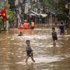 Children play in their neighborhood near the Red River, which is flooded following Typhoon Yagi in September 2024, in Hanoi, Vietnam.