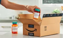 A photograph of an Amazon box with medicines.