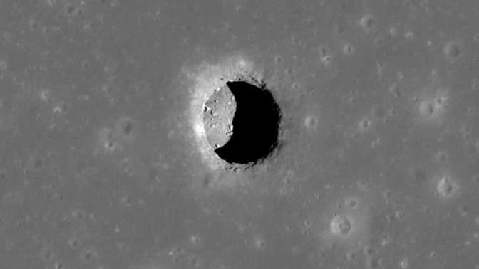 A pit, leading to a cave, in the Mare Tranquillitatis region of the moon.