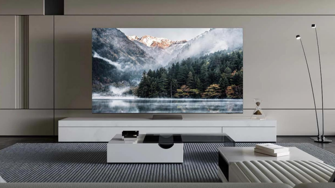 Samsung TV in living room setup with mountains and trees landscape on screen