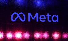 A Meta logo on a neon background.