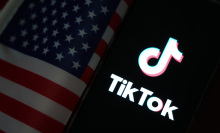 The TikTok logo next to an American flag.