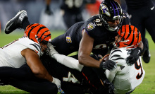 oe Burrow of the Cincinnati Bengals is sacked by the Ravens