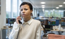 Harper Stern on the phone in an office.