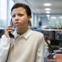 Harper Stern on the phone in an office.