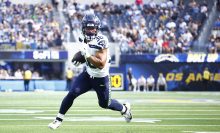 George Holani of the Seattle Seahawks scores a touchdown