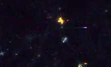 Two bright meteors streak above Earth in new video from space