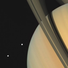 In November 1980, Voyager 1 snapped this image of Saturn and two of the gas giant's moons.