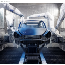 The body of a Tesla Model Y getting a blue paint job. 