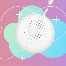 Soothe-n-Sleep White Noise Machine on a pink and blue background.