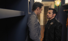 Giuseppe (Sebastiano Pigazzi) and Anthony (Mario Cantone) stand in Carrie's closet facing each other 